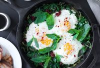 Baked Eggs with Ricotta, Greens & Sun-Dried Tomatoes