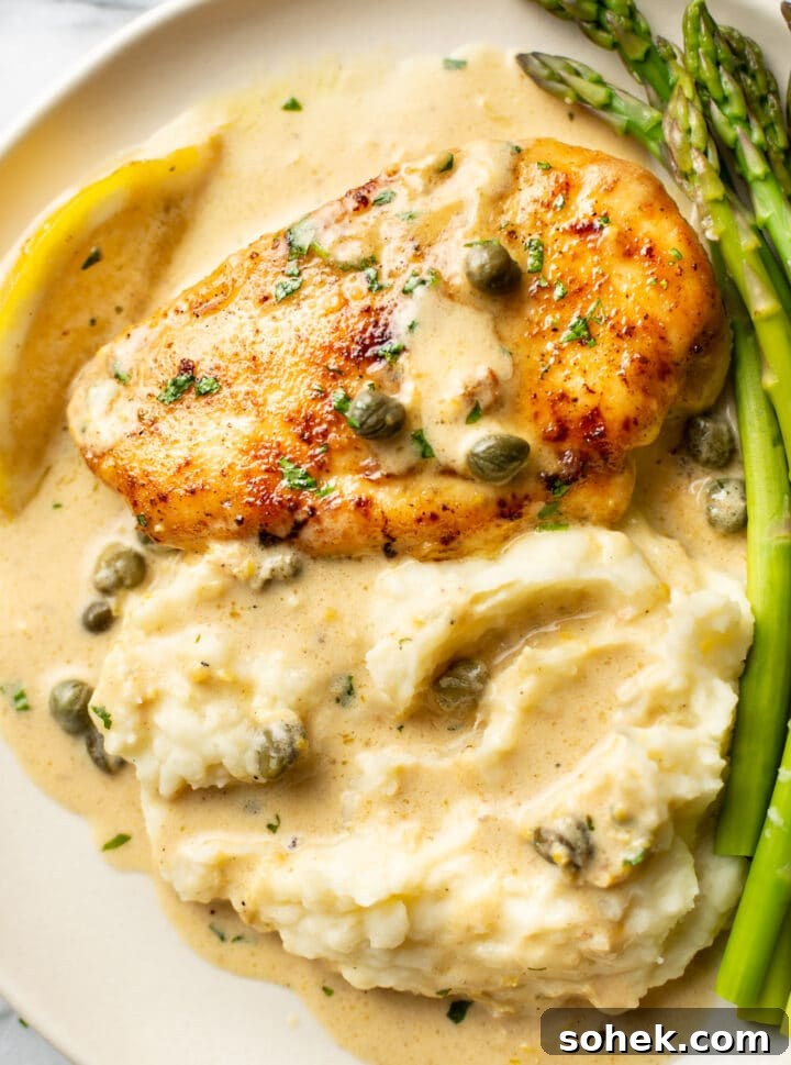 Classic Chicken Piccata Recipe – Tangy Lemon Capers Guide 6 close-up of a plate with chicken piccata, green beans, and mashed potatoes with sauce