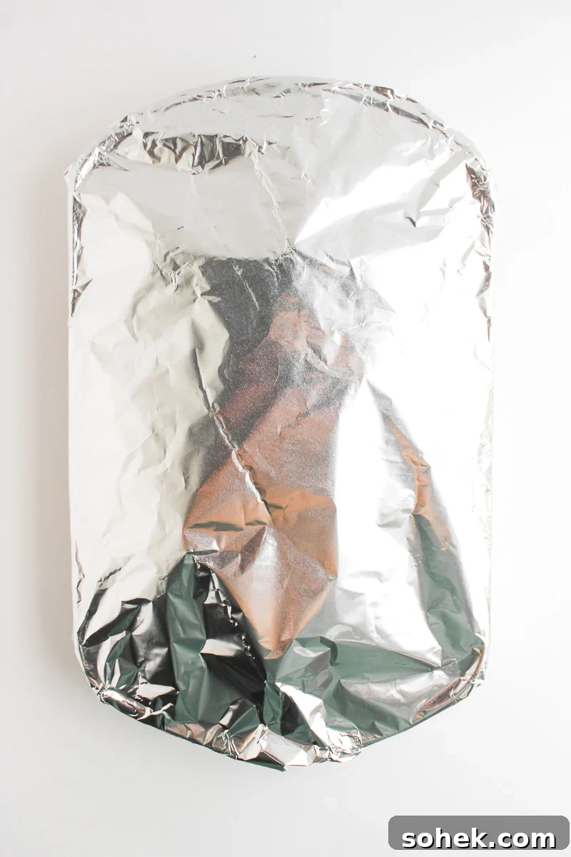Sliers are werapped in foil before placing in oven.