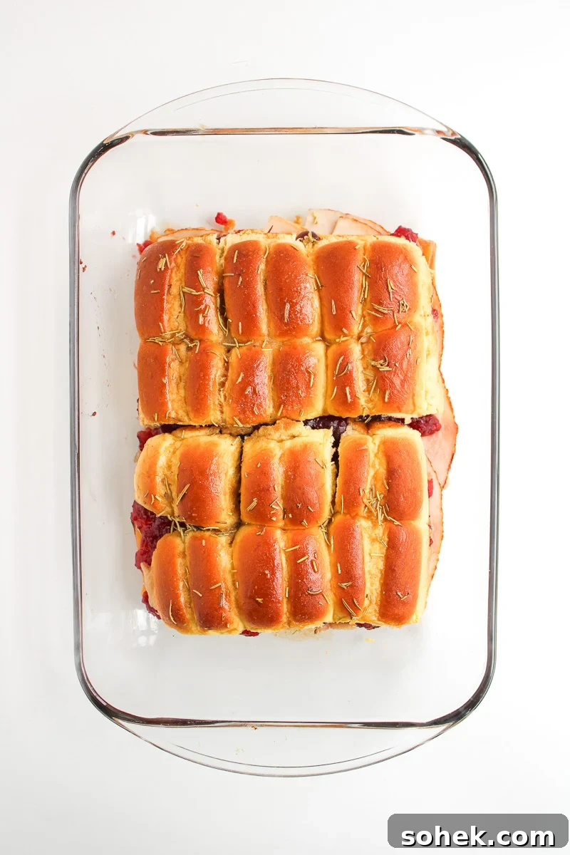 Baked sliders removed from the oven and ready to cut and eat.