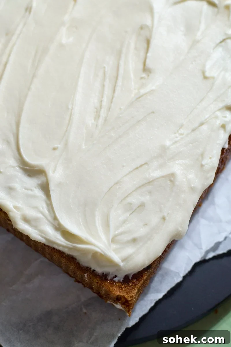 Sourdough Discard Carrot Cake Recipe for Moist, Flavorful Loaf 11 Icing spread on top of the cake.