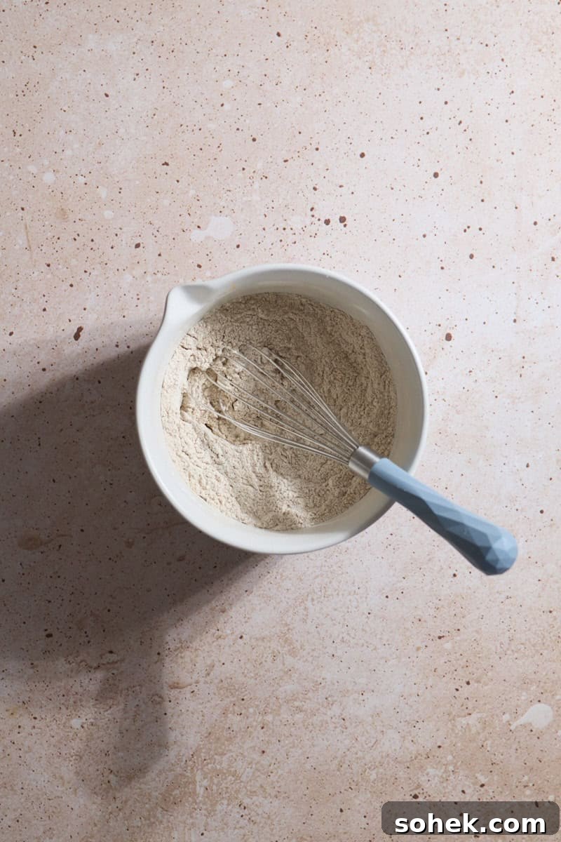 Sourdough Discard Carrot Cake Recipe for Moist, Flavorful Loaf 4 Dry ingredients whisked together in a small bowl.