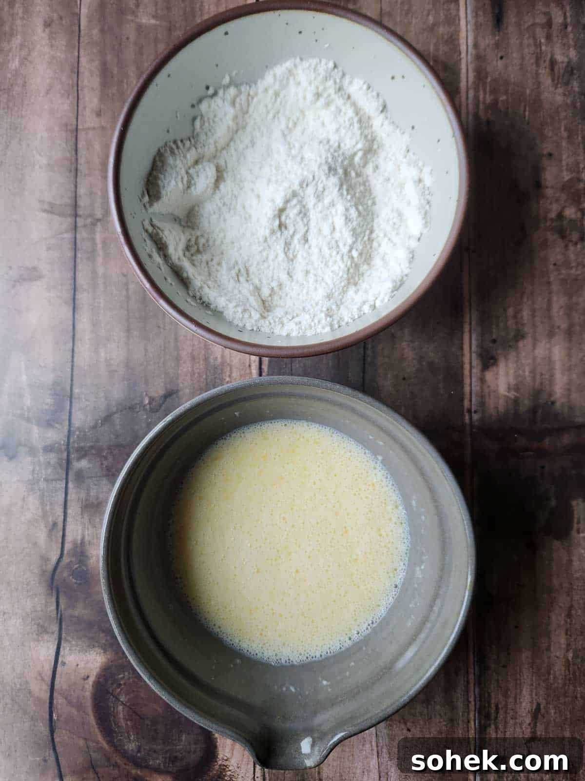 Mini Toaster Waffles: Quick Crispy Breakfast Bites 4 Overhead view of two bowls with dry and wet ingredients for waffle batter.