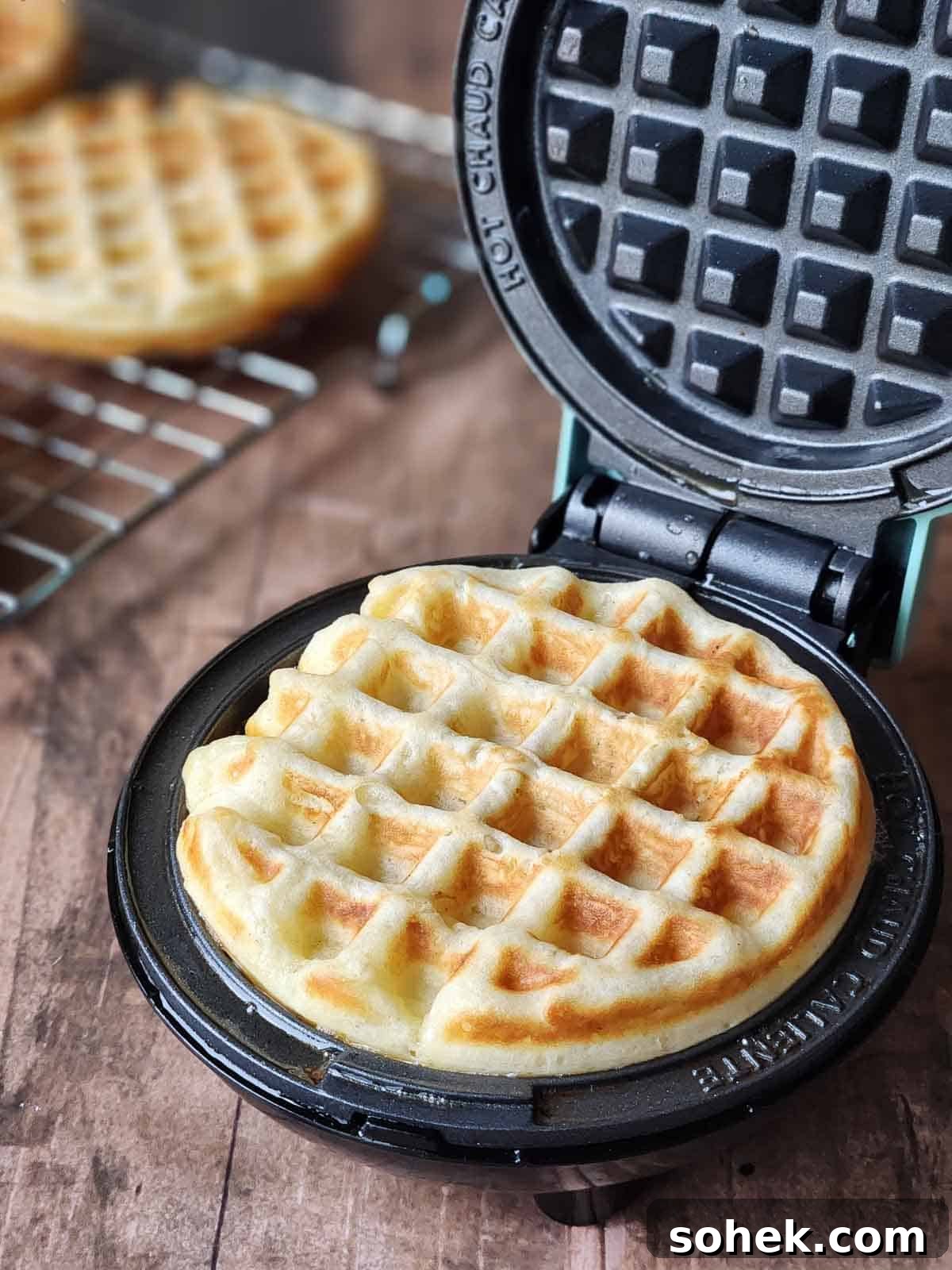 Mini Toaster Waffles: Quick Crispy Breakfast Bites 7 Cooked waffle shown in a mini waffle maker.