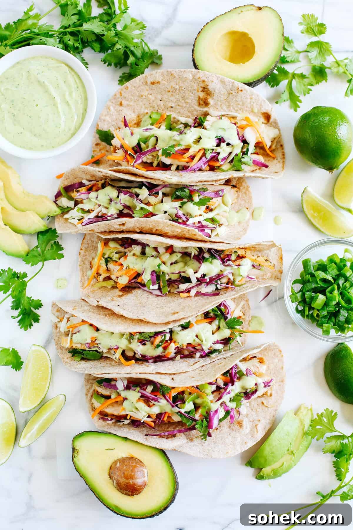 Cilantro Lime Chicken Tacos with coleslaw and avocado crema
