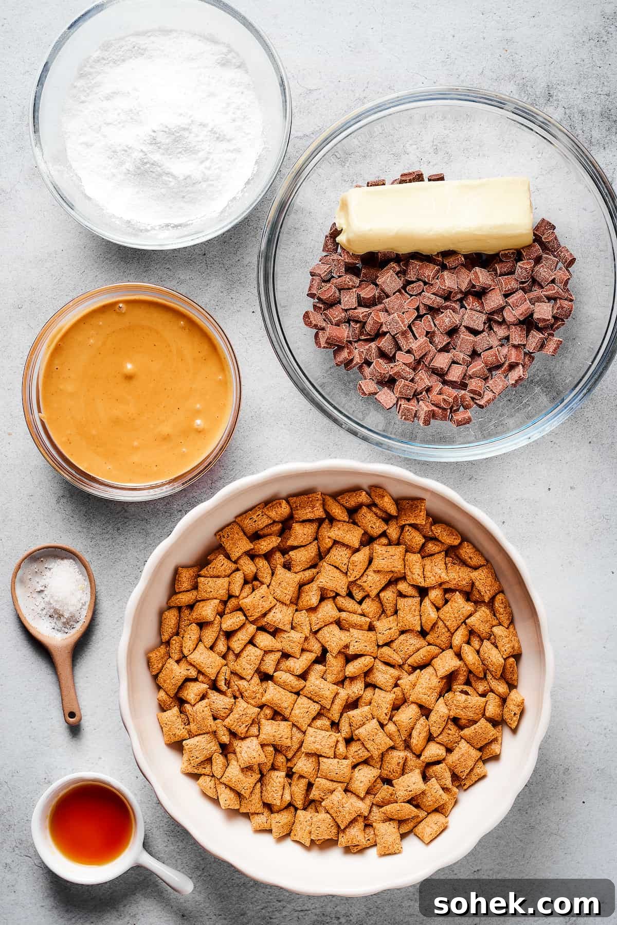 Who’s up for Muddy Buddies? Smooth chocolate, salty peanut butter, and a light dusting of powdered sugar make this crispy Chex cereal snack a true favorite! From top left: Powdered sugar, chocolate chunks , a stick of butter, dry Chex cereal, sea salt, peanut butter.