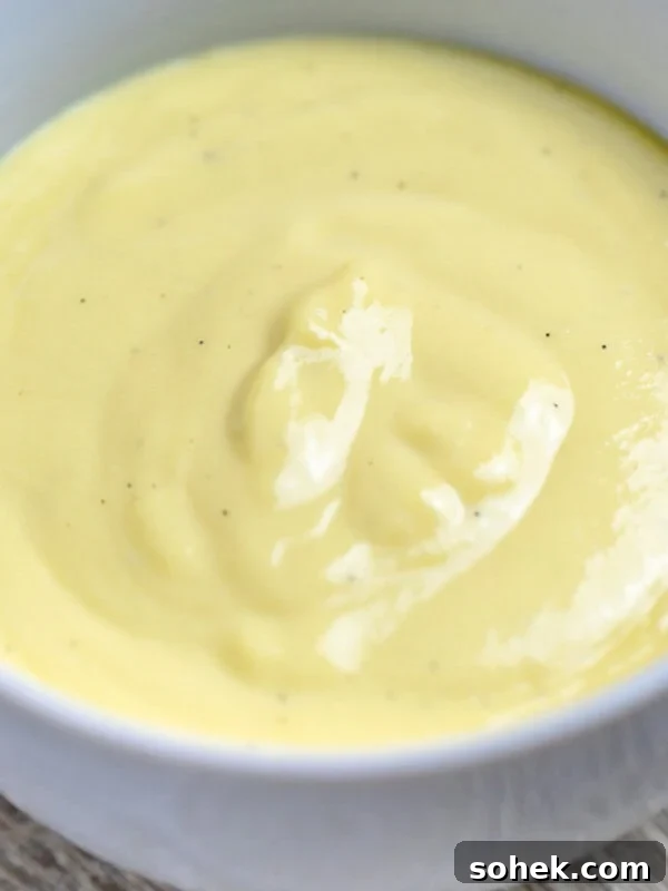 Homemade Raspberry Sauce Recipe for Desserts and Toppings 12 vanilla sauce bread pudding sauce in a bowl