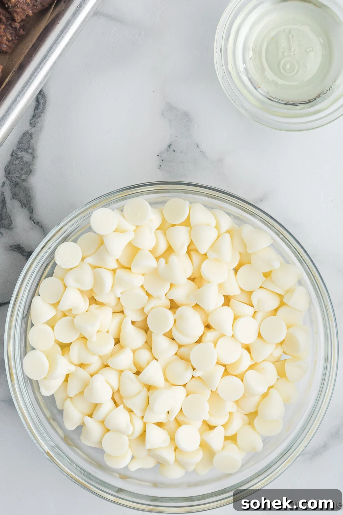 Oreo Puppy Chow Recipe: No-Bake Chocolate Cookie Snack 6 White chocolate chips in a bowl.