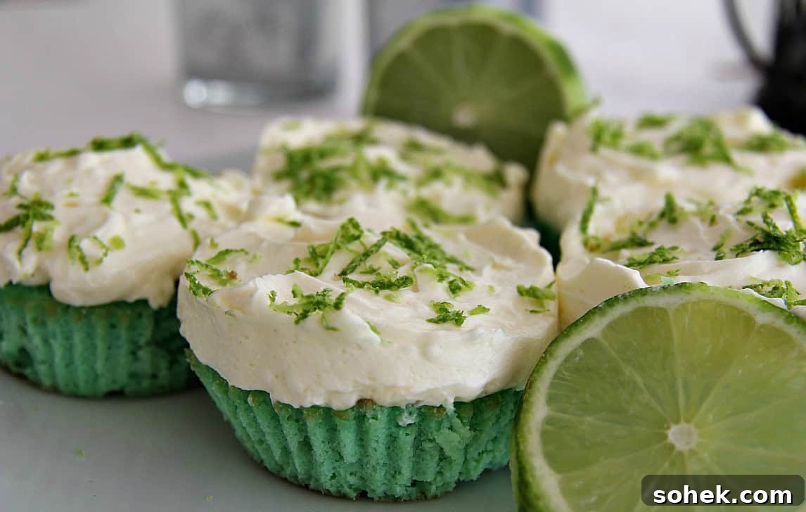 Strawberry Cream Cupcakes: Moist Vanilla Cupcakes with Fresh Strawberry Frosting 8 Key lime cupcakes with white frosting and lime zest, displayed with fresh lime slices, sit charmingly beside strawberry cream cupcakes.