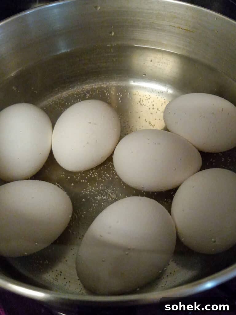 Authentic Amish Pickled Eggs and Beets Recipe for Tangy Flavor 3 eggs in a pot of water.