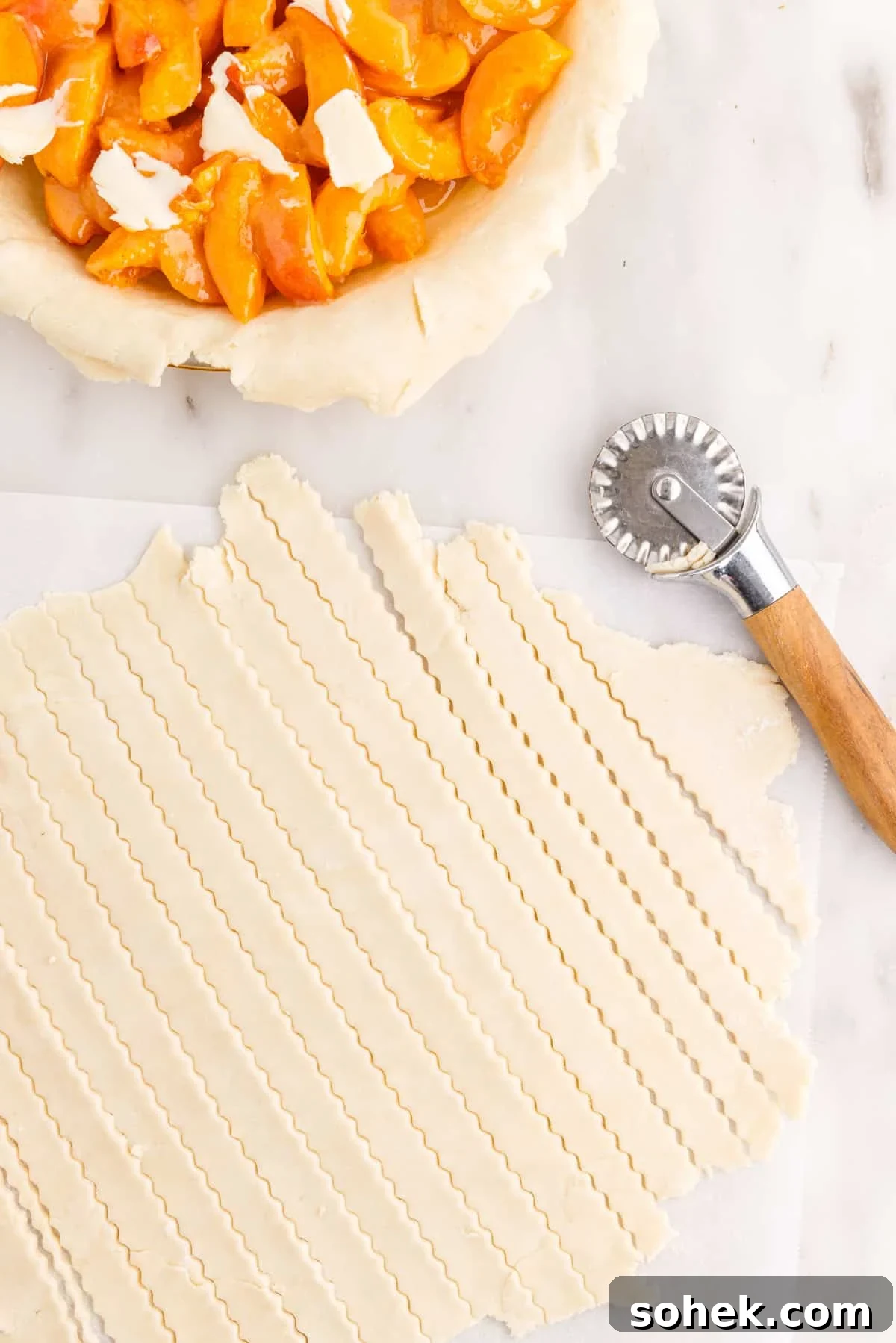 Top pie crust cut into ½" strips with fluted pastry wheel.