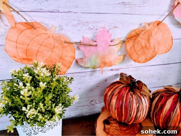 12 Fun Fall Crafts for Kids to Make at Home 12 garland with painted pumpkins and leaves made from coffee filters