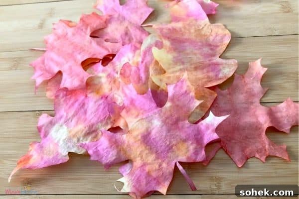 12 Fun Fall Crafts for Kids to Make at Home 6 colorful fall leaves made from coffee filters