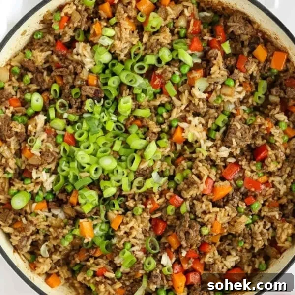 Rice, beef mince and vegetables mixed together for Beef Fried Rice dish.