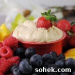 Cream Cheese Fruit Dip: 3-Ingredient Recipe for Parties 11 3 ingredient cream cheese fruit dip surrounded by fruit for dipping.