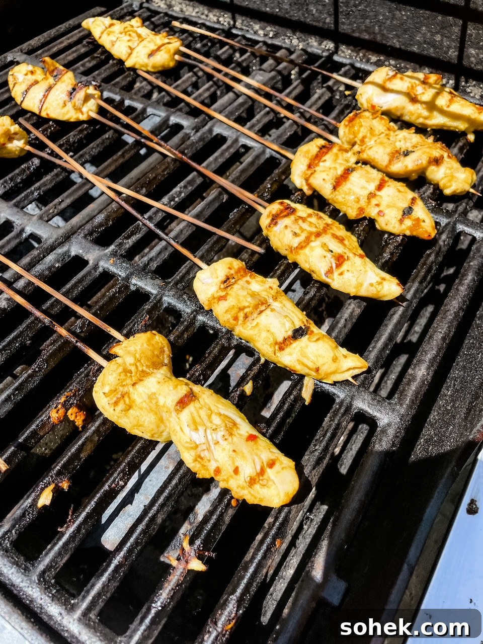 Asian Chicken Skewers with Creamy Peanut Dipping Sauce 5 The skewers being grilled