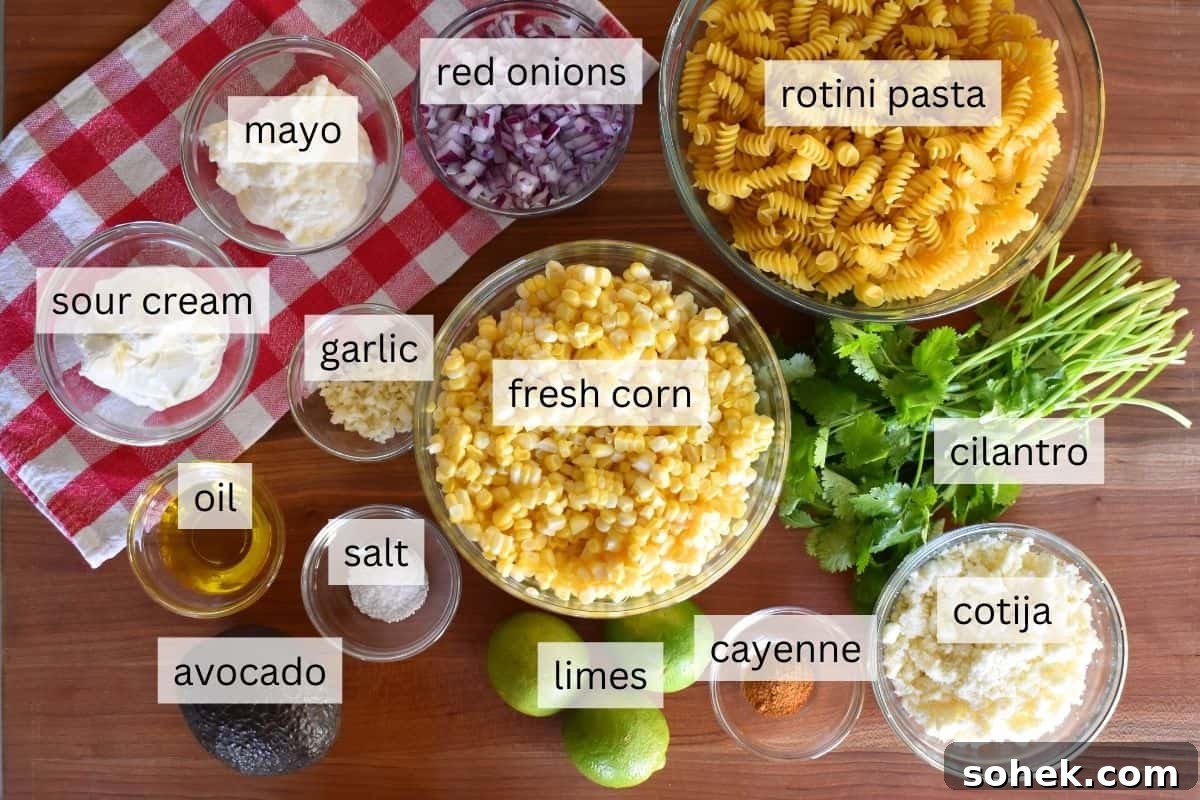 Mexican Elote Pasta Salad: Creamy Street Corn Pasta Recipe 4 Ingredients for recipe including corn, cotija cheese, rotini, avocado, and cilantro.