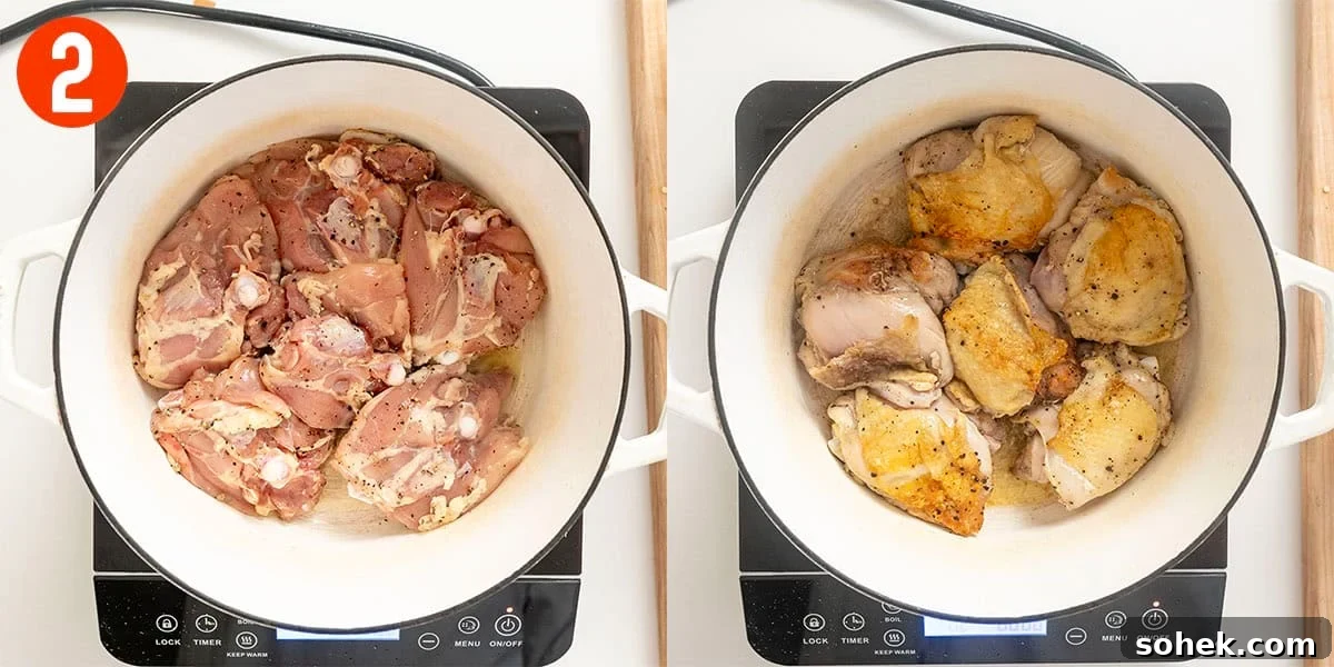 Searing chicken thighs in a dutch oven.