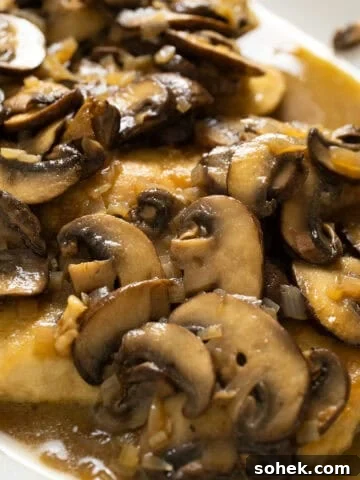 Chicken marsala with mushrooms served over top.