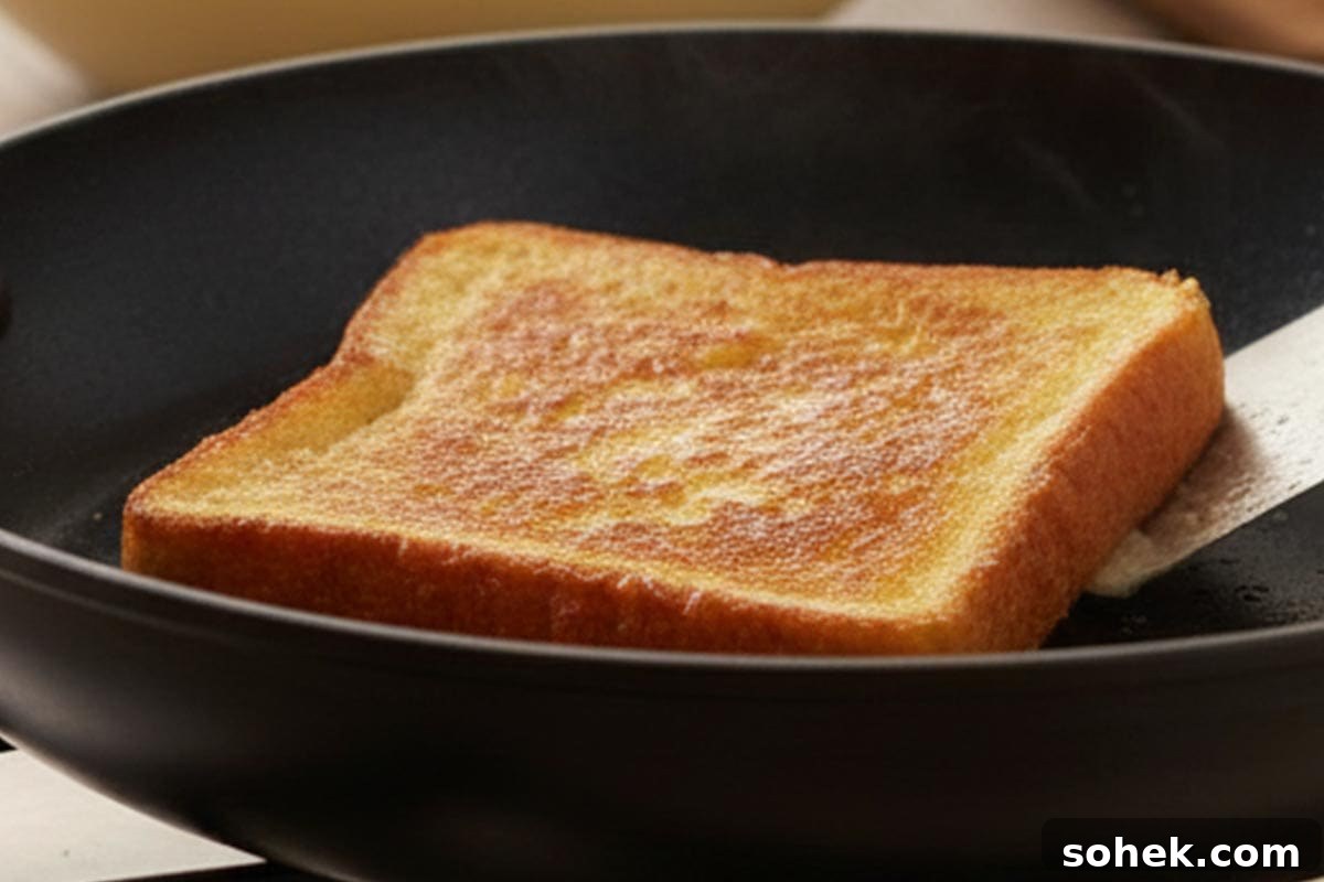 Pineapple Coconut French Toast Recipe — Piña Colada Flavor 5 Toasting the bread.