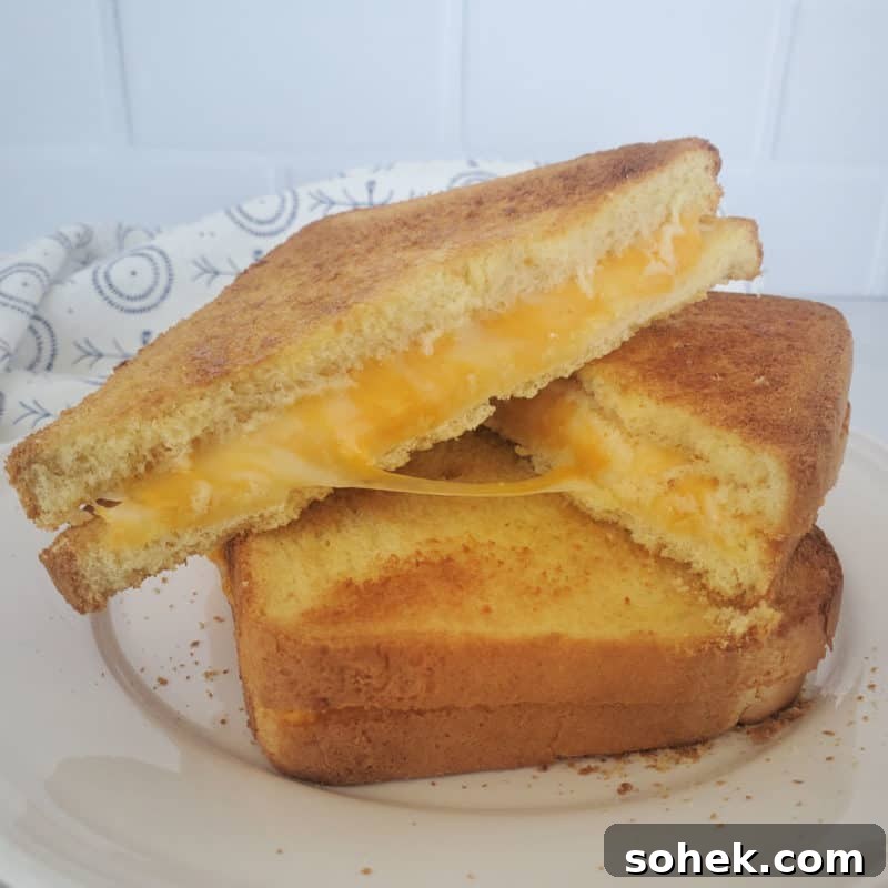 air fried grilled cheese stacked on a white plate