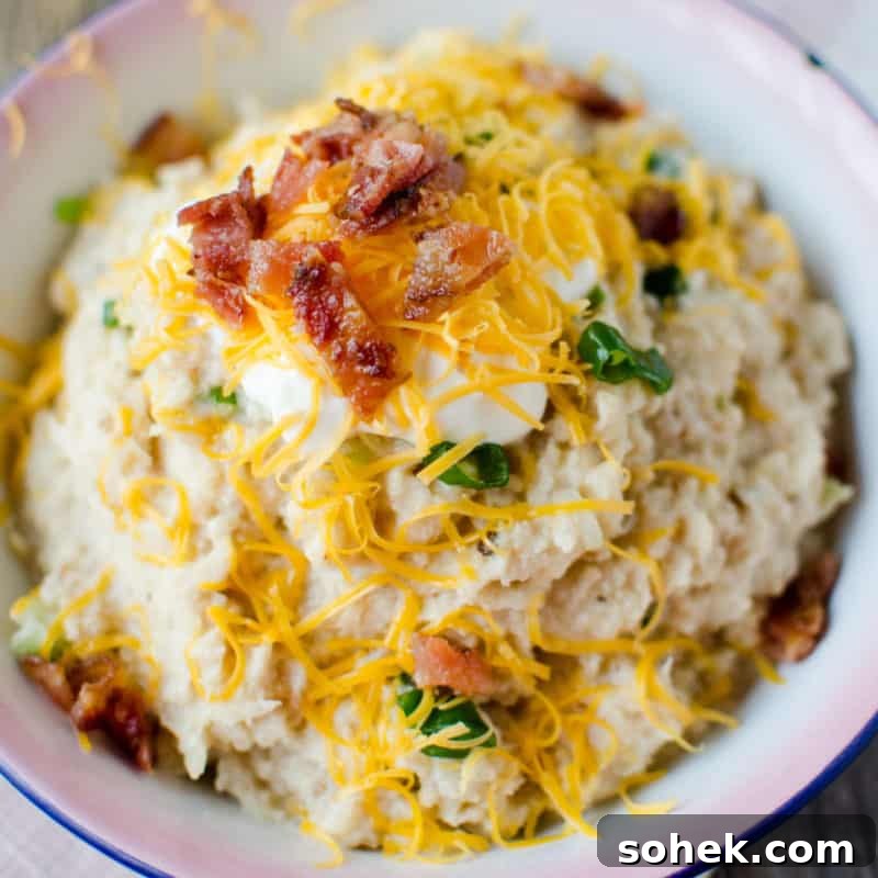 mashed cauliflower topped with cheddar cheese and bacon