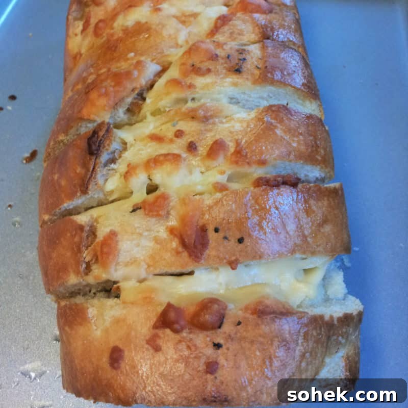 cheesy garlic bread on a baking sheet