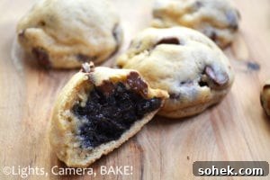 Oreo Truffle Stuffed Chocolate Chip Cookies are decadent oreo truffles encased in a soft and rich chocolate chip cookie.
