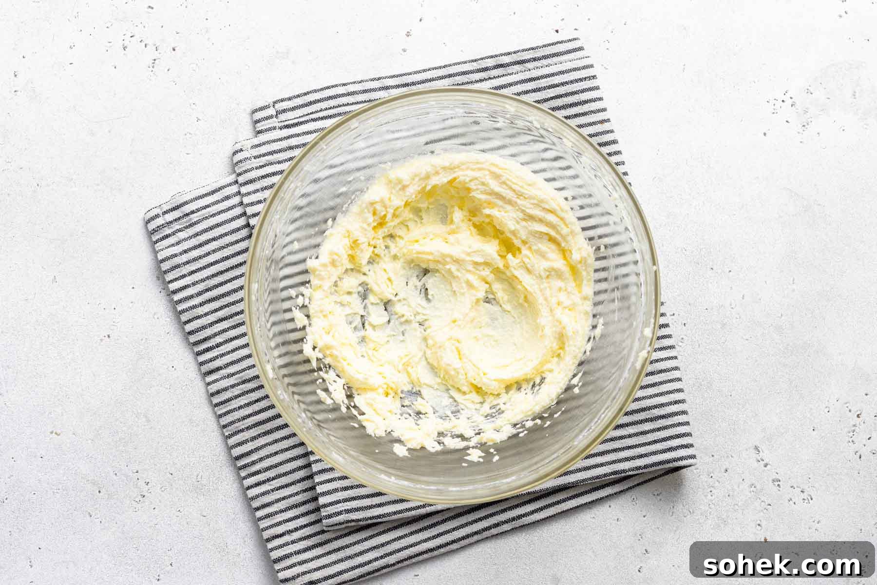 Zesty Lemon Cupcakes Recipe with Luscious Lemon Frosting 6 Butter and sugar, beaten together in clear bowl.