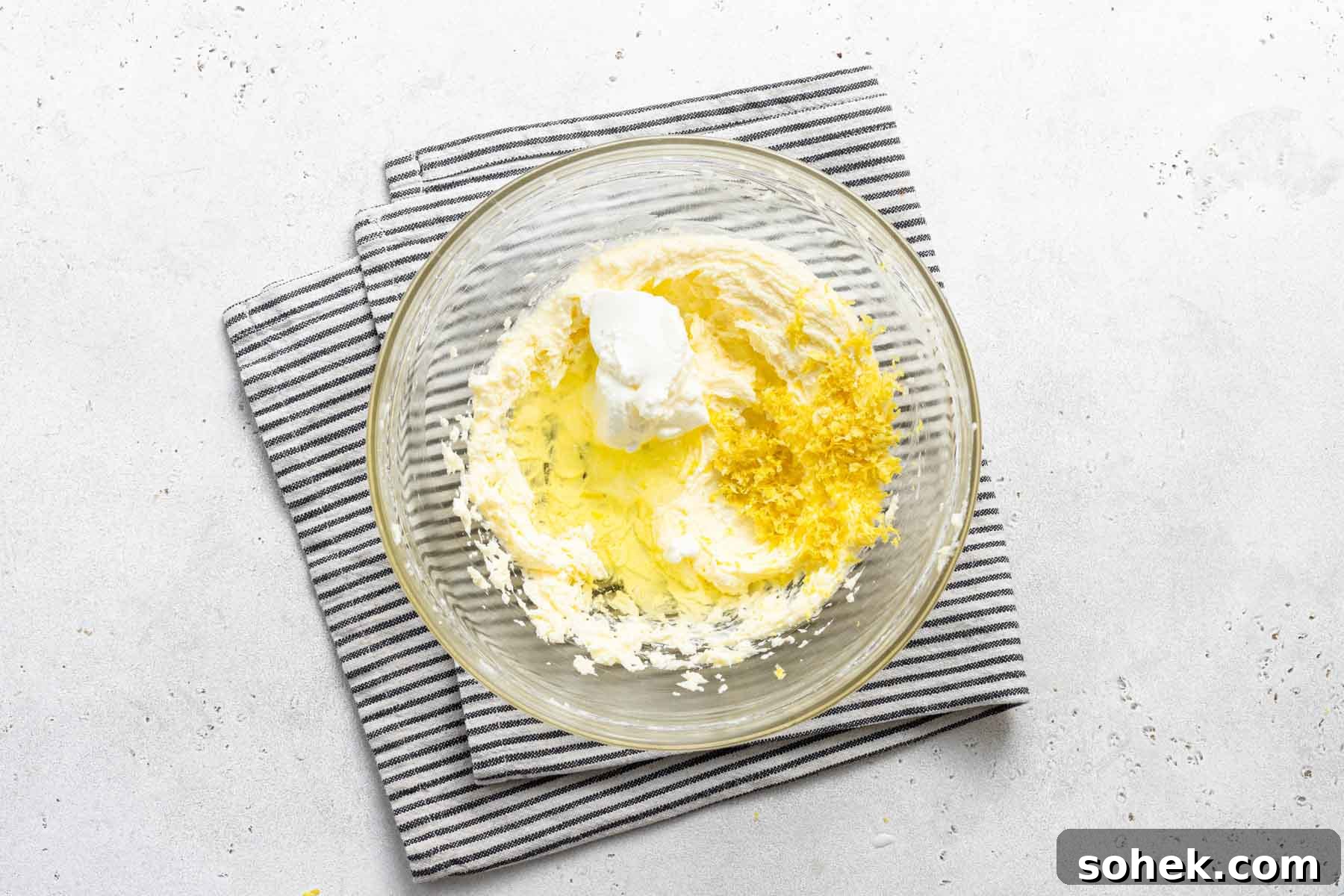 Zesty Lemon Cupcakes Recipe with Luscious Lemon Frosting 7 Lemon cupcake batter in bowl.