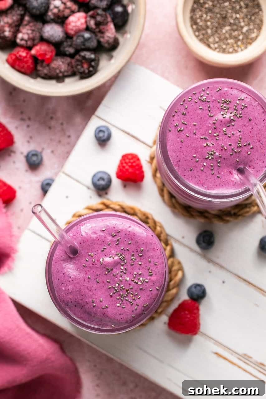 an overhead shot of two smoothies topped with chia seeds 