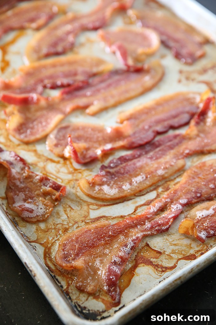 A baking sheet full of cooked bacon.