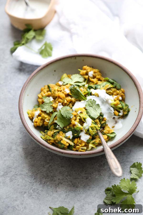 Ayurvedic Green Kitchari Cleansing Bowl Recipe 2 kitchari in a bowl with cilantro and yogurt topping