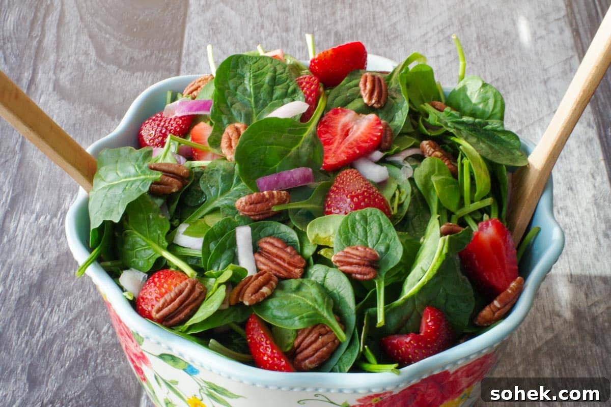 Zucchini and Potato Soup with Fresh Dill Recipe 11 strawberry spinach pecan salad in a large bowl with flower print and wooden utensils