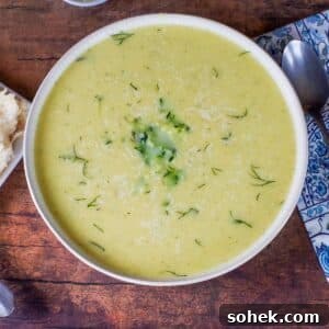 Zucchini and Potato Soup with Fresh Dill Recipe 17 Zucchini Potato soup in a beige bowl with blue paisley napkin and spoon on the side