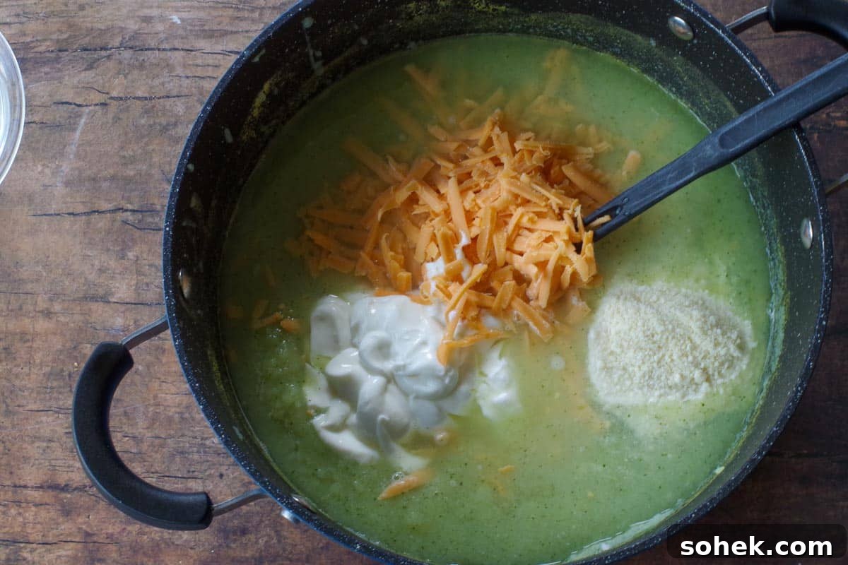 Zucchini and Potato Soup with Fresh Dill Recipe 7 broth with potatoes whisked in and sour cream, parmesan cheese, cheddar cheese and lime juice added to the pot