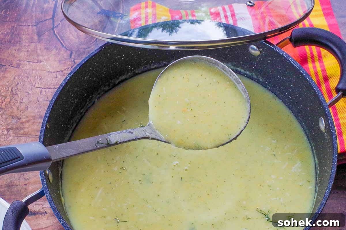 Zucchini and Potato Soup with Fresh Dill Recipe 8 zucchini potato soup being ladled out of pot