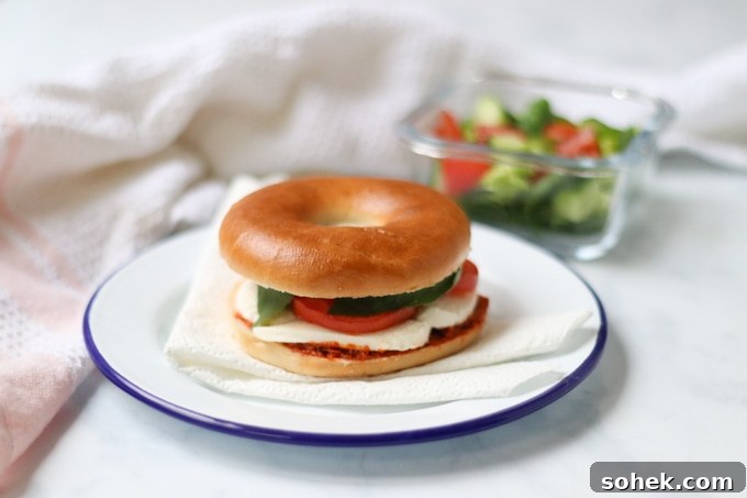 Pesto Caprese Bagel Recipe: Fresh Tomato, Mozzarella & Basil 4 Pesto Caprese Bagel with side salad
