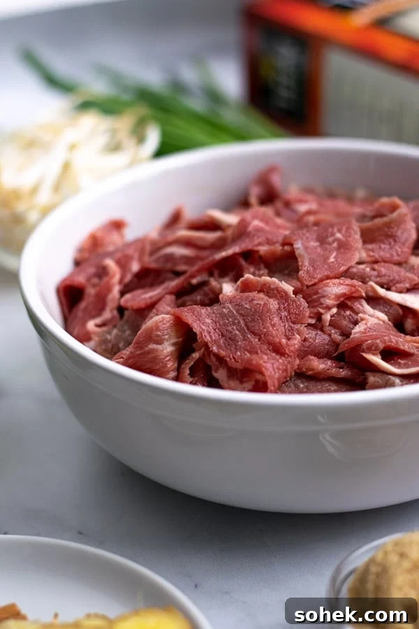 shaved steak in a bowl for the pho soup recipe