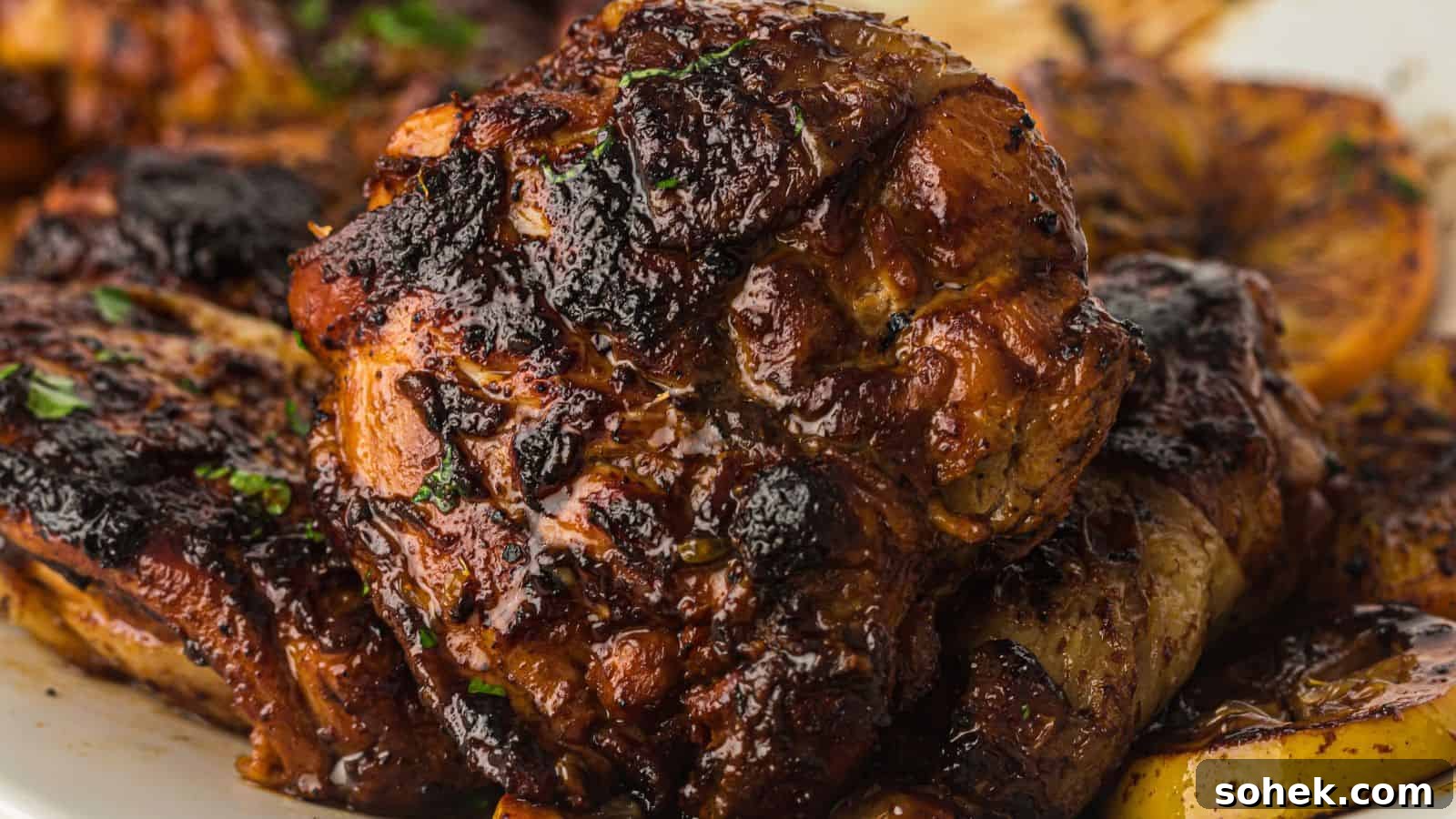 33 Quick Chicken Dinners for Busy Nights When You’re Tired but Hungry 16 Close-up of grilled, well-seasoned, and charred chicken pieces with visible herbs on a plate.