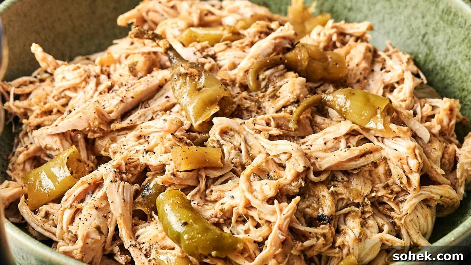 33 Quick Chicken Dinners for Busy Nights When You’re Tired but Hungry 17 Shredded chicken mixed with sliced green peppers and seasoning in a green bowl.