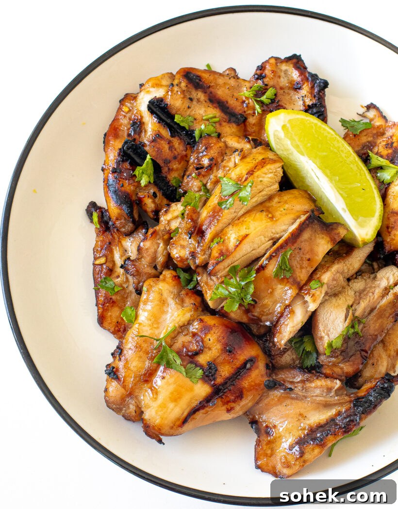 Honey-Lime Grilled Chicken with Sweet Citrus Glaze 12 Honey lime chicken breasts garnished with cilantro and lime wedges.