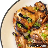 Honey-Lime Grilled Chicken with Sweet Citrus Glaze 13 Honey lime chicken thighs on a plate.