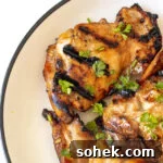 Honey-Lime Grilled Chicken with Sweet Citrus Glaze 14 Honey lime chicken thighs on a plate.