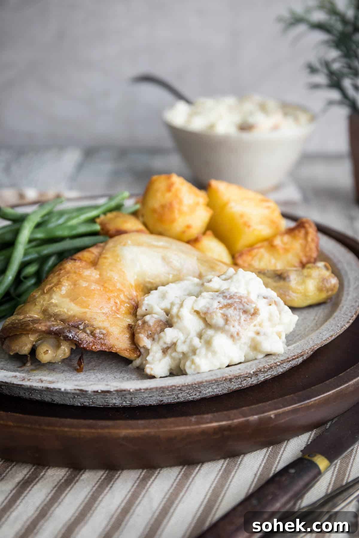 Classic Gluten-Free Bread Sauce Recipe for Roast Dinners 2 Plate of bread sauce accompanying roast chicken and vegetables. Next to bowl of bread sauce.