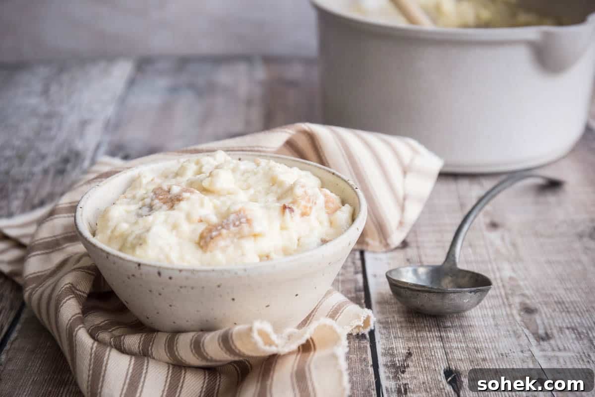 Classic Gluten-Free Bread Sauce Recipe for Roast Dinners 11 Bowl of bread sauce next to spoon.