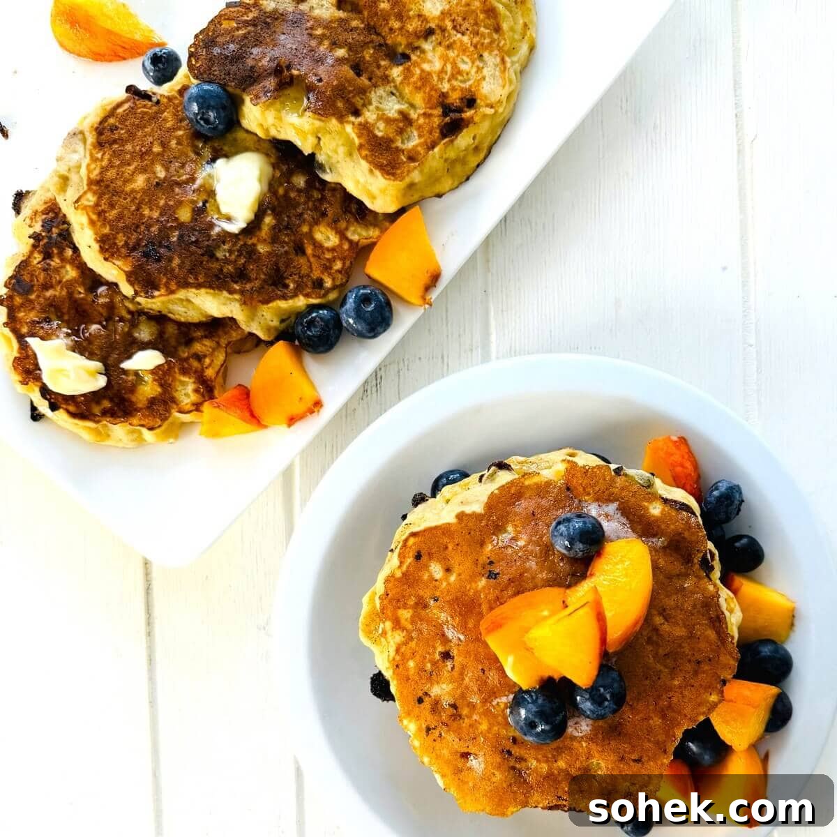 Fluffy Banana and Cottage Cheese Pancakes for Protein-Packed Breakfast 20 A stack of protein pancakes with bananas and a serving plate.