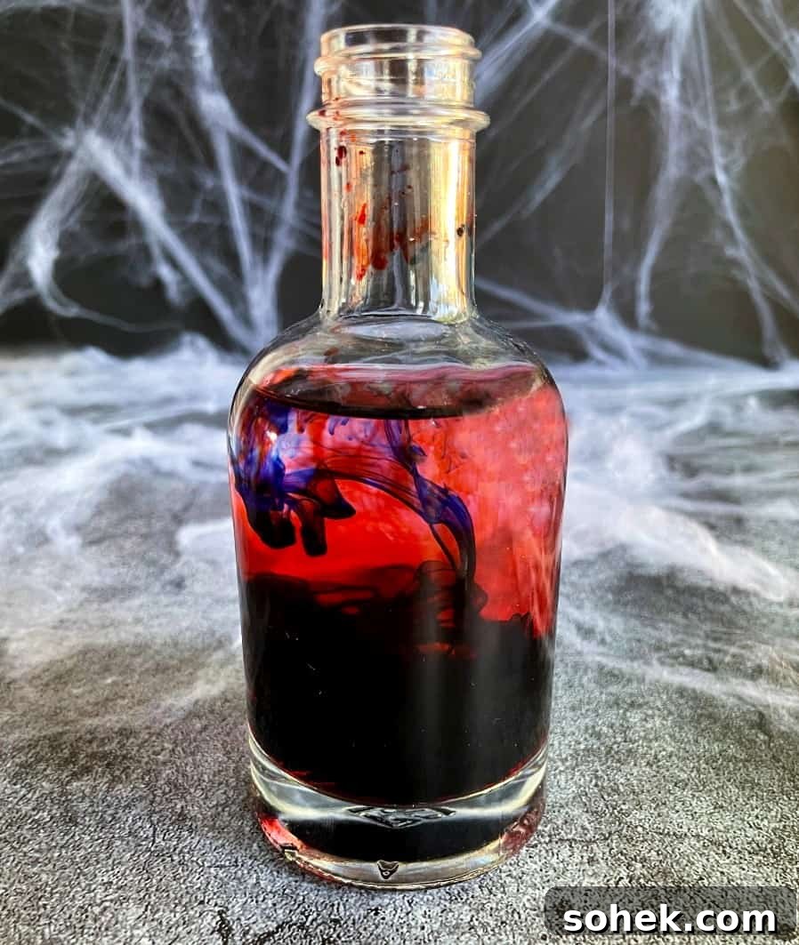 Black Vodka: What It Is, How It's Made, and How to Drink It 4 vodka in a bottle with food coloring added.