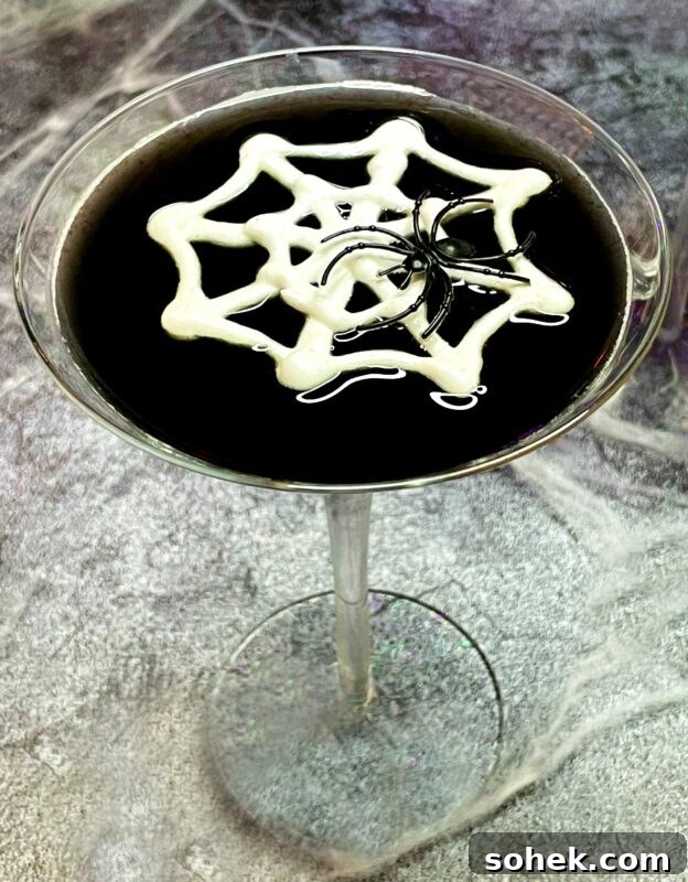 Black Vodka: What It Is, How It's Made, and How to Drink It 7 black martini with a meringue web and a toy spider.
