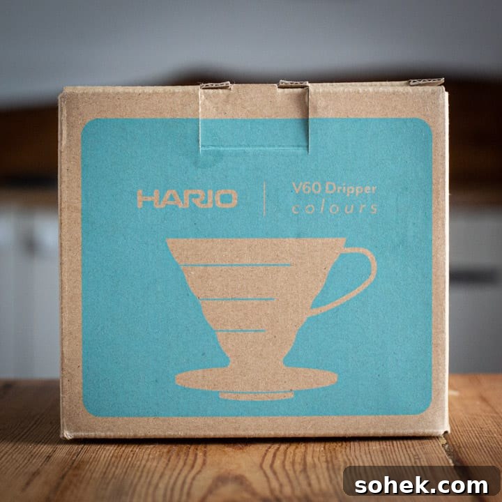 brown and turquoise box for the Hario v60 coffee maker on wooden surface